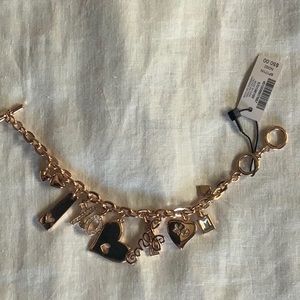 New, with tags, rose gold charm bracelet. 7-8” adjustable clasp.